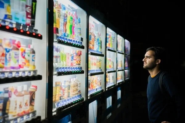 Person viewing rows of vending machines